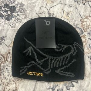 Arc'teryx Black Beanie with Gray and Gold Accents
